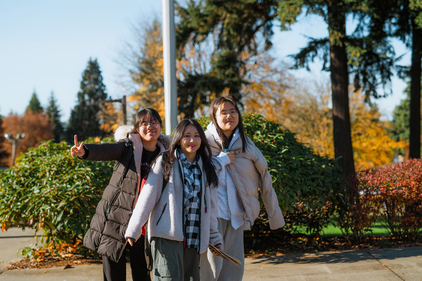 Three international students from China walk to their next class at Northwest University.